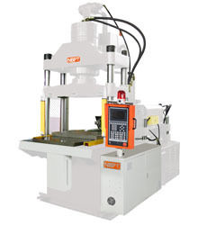 Machine de moulage par injection verticale pour les bords d'automobiles